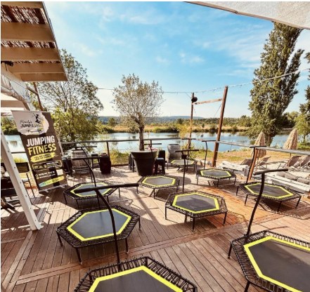 Hexagonal trampolines set up on the lakeside deck